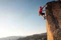 a man climing amountain